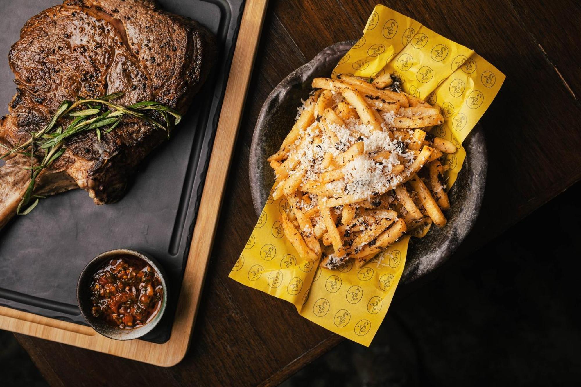 Voco Orchard Singapore By Ihg Екстер'єр фото A plate of chips and steak